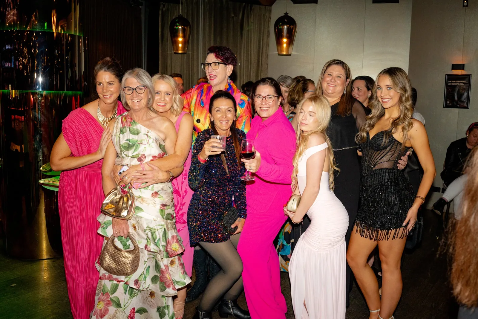 A group of guests celebrating together at an evening event