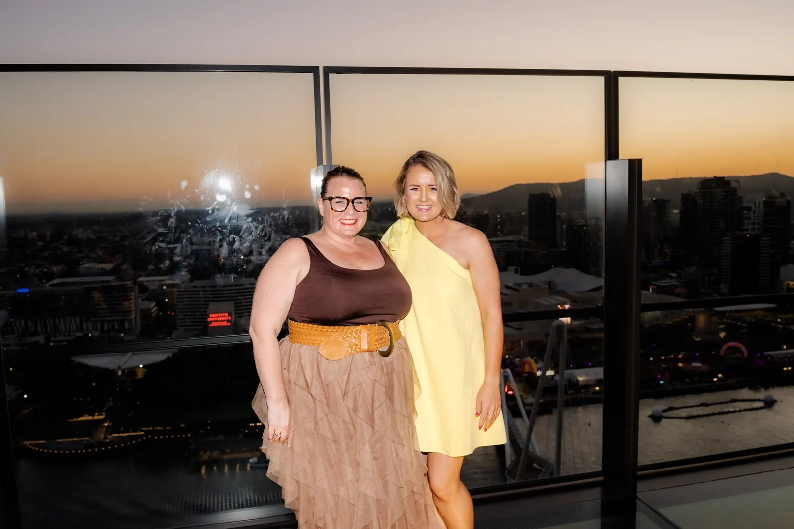 Two RAYE Haus members together at an evening event
