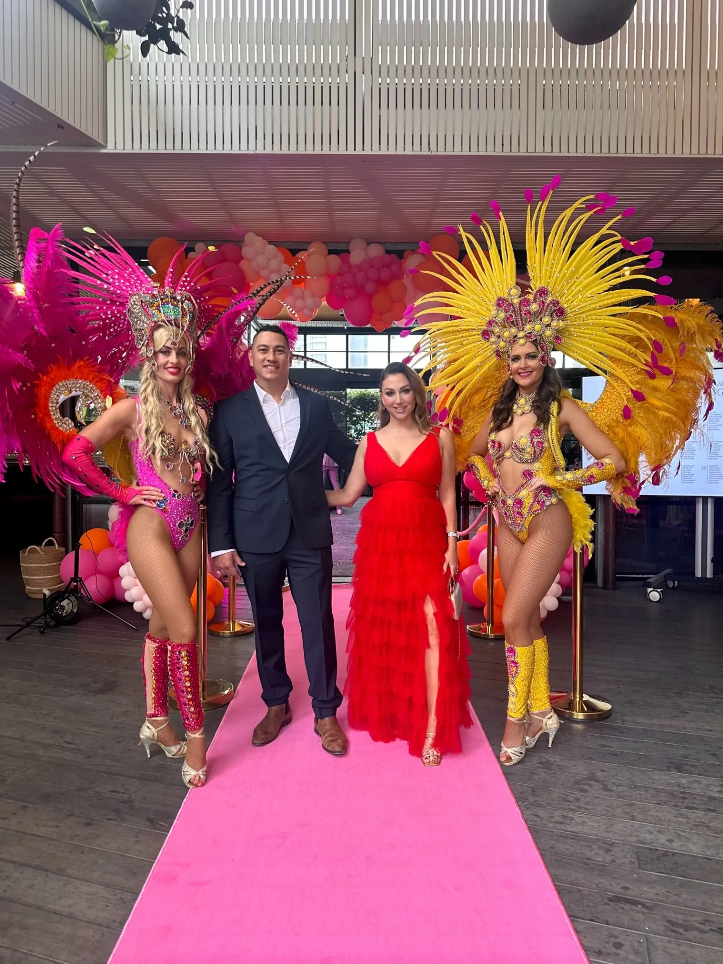 Beck Smith at the Beam Awards with performers on a pink carpet